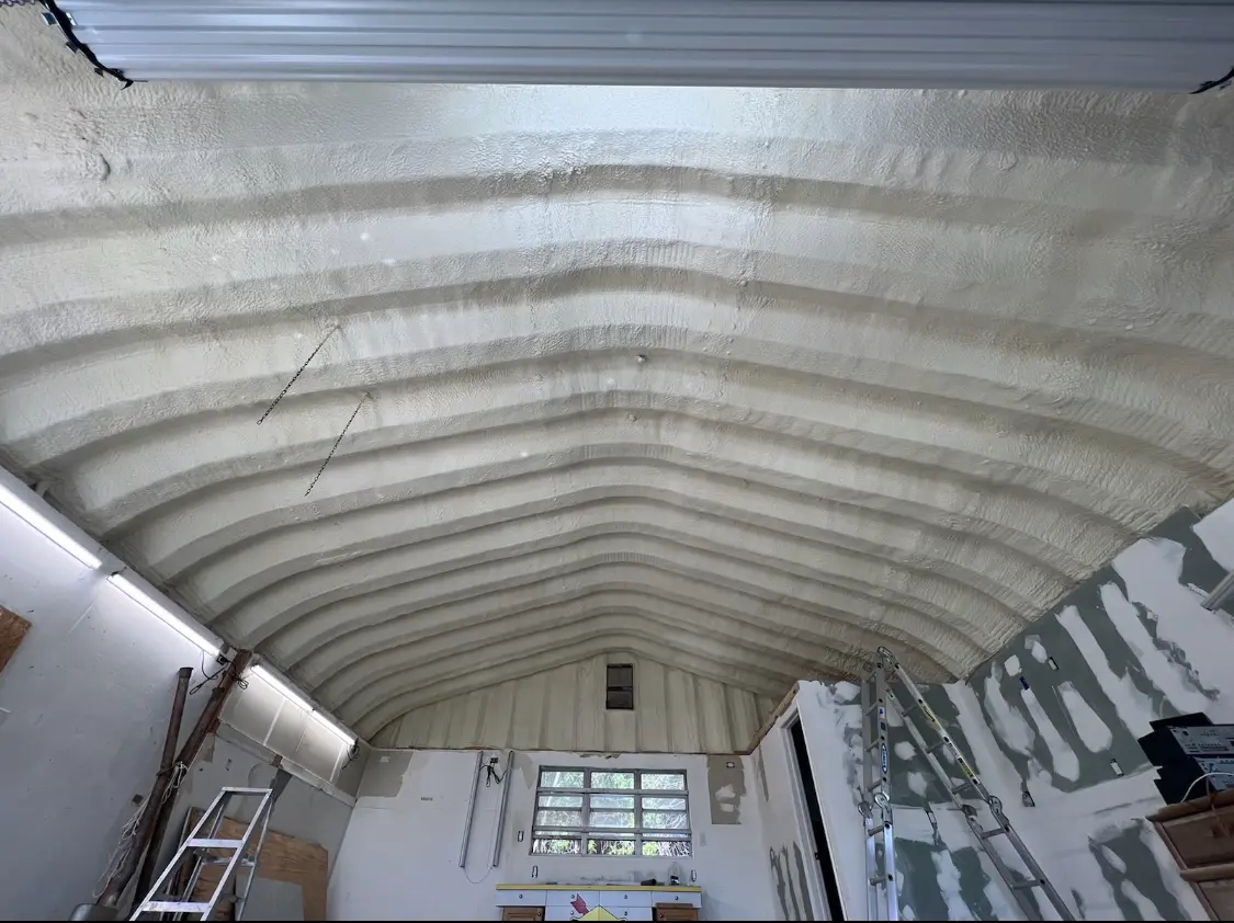 Spray polyurethane foam applied to the underside of a metal roof deck in Kathleen